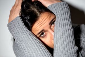 close up of unhappy woman crying on floor